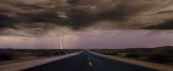 Movie still from “Coyote Ugly” (2000), directed by David McNally – A road with a lightning strike in the background; Extreme Wide shot, Low angle