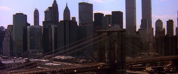 Movie still from “Coyote Ugly” (2000), directed by David McNally – A view of a bridge and a city skyline; Extreme Wide shot, High angle