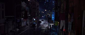 Movie still from “Coyote Ugly” (2000), directed by David McNally – A city street at night lit by street lights; Extreme Wide shot, High angle