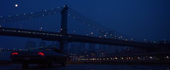 Movie still from “Coyote Ugly” (2000), directed by David McNally – A view of a bridge at night with lights on it; Extreme Wide shot, Low angle
