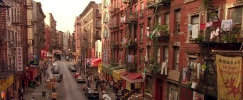 Movie still from “Coyote Ugly” (2000), directed by David McNally – A busy street in a city with many people walking on the sidewalk; Extreme Wide shot, High angle