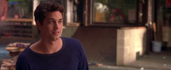 Movie still from “Coyote Ugly” (2000), directed by David McNally – A man in a blue shirt is looking at the camera; Close Up shot, High angle
