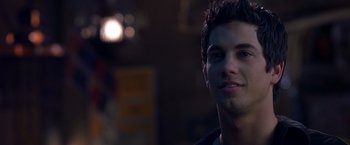 Movie still from “Coyote Ugly” (2000), directed by David McNally – A person wearing a headset; Close Up shot, Over the shoulder angle
