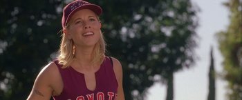 Movie still from “Coyote Ugly” (2000), directed by David McNally – A beautiful young lady wearing a baseball cap; Close Up shot, Low angle