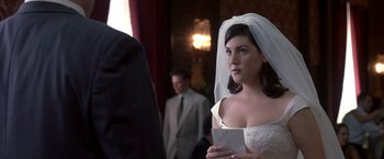 Movie still from “Coyote Ugly” (2000), directed by David McNally – A woman wearing a veil and holding a letter; Close Up shot, Over the shoulder angle