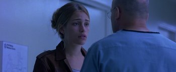 Movie still from “Coyote Ugly” (2000), directed by David McNally – A young woman is looking at a man; Close Up shot, Over the shoulder angle