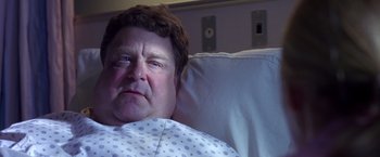 Movie still from “Coyote Ugly” (2000), directed by David McNally – A person laying in a hospital bed; Close Up shot, Low angle