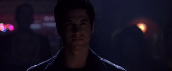 Movie still from “Coyote Ugly” (2000), directed by David McNally – A person wearing a black shirt; Close Up shot, Over the shoulder angle