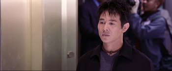 Movie still from “Cradle 2 the Grave” (2003), directed by Andrzej Bartkowiak – A person wearing a jacket; Close Up shot, High angle