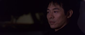 Movie still from “Cradle 2 the Grave” (2003), directed by Andrzej Bartkowiak – A person looking at the camera; Close Up shot, Low angle