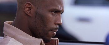 Movie still from “Cradle 2 the Grave” (2003), directed by Andrzej Bartkowiak – A man's face , looking to his left; Close Up shot, Low angle