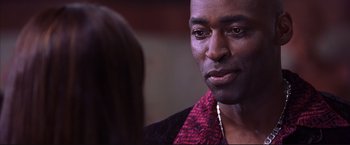 Movie still from “Cradle 2 the Grave” (2003), directed by Andrzej Bartkowiak – A person talking to another person; Close Up shot, Over the shoulder angle