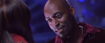 Movie still from “Cradle 2 the Grave” (2003), directed by Andrzej Bartkowiak – A person wearing a red tie; Close Up shot, Low angle