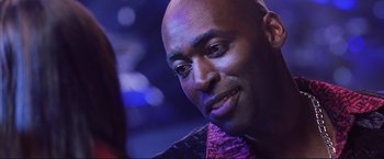 Movie still from “Cradle 2 the Grave” (2003), directed by Andrzej Bartkowiak – A person wearing a tie; Close Up shot, Over the shoulder angle