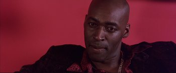 Movie still from “Cradle 2 the Grave” (2003), directed by Andrzej Bartkowiak – A person wearing a jacket; Close Up shot, Low angle