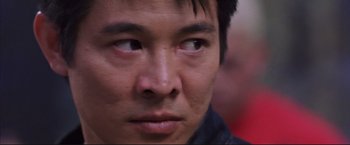 Movie still from “Cradle 2 the Grave” (2003), directed by Andrzej Bartkowiak – A man's eyes and face; Close Up shot, Low angle