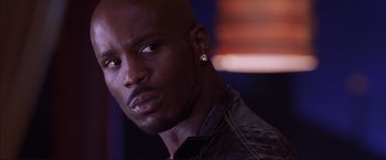 Movie still from “Cradle 2 the Grave” (2003), directed by Andrzej Bartkowiak – A person wearing a jacket; Close Up shot, Low angle