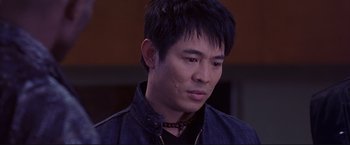 Movie still from “Cradle 2 the Grave” (2003), directed by Andrzej Bartkowiak – A person wearing a jacket; Close Up shot, High angle