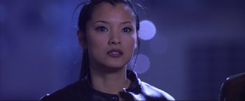 Movie still from “Cradle 2 the Grave” (2003), directed by Andrzej Bartkowiak – A person wearing a leather jacket; Close Up shot, Low angle