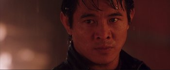 Movie still from “Cradle 2 the Grave” (2003), directed by Andrzej Bartkowiak – A man's face in the rain; Close Up shot, Low angle