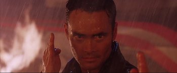 Movie still from “Cradle 2 the Grave” (2003), directed by Andrzej Bartkowiak – A man's face in the pouring rain; Close Up shot, Low angle