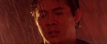 Movie still from “Cradle 2 the Grave” (2003), directed by Andrzej Bartkowiak – A man's face in the rain; Close Up shot, Low angle