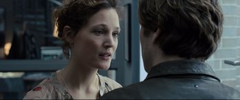 Movie still from “The Girl in the Spider's Web” (2018), directed by Fede Alvarez – A man and a woman looking at one another; Close Up shot, Over the shoulder angle