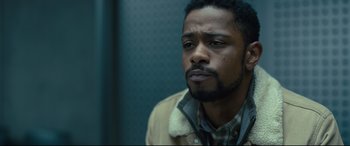 Movie still from “The Girl in the Spider's Web” (2018), directed by Fede Alvarez – A person wearing a jacket; Close Up shot, Over the shoulder angle