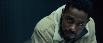 Movie still from “The Girl in the Spider's Web” (2018), directed by Fede Alvarez – A person wearing a jacket; Close Up shot, Low angle