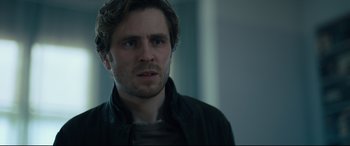 Movie still from “The Girl in the Spider's Web” (2018), directed by Fede Alvarez – A person wearing a jacket; Close Up shot, Over the shoulder angle