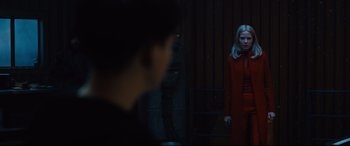 Movie still from “The Girl in the Spider's Web” (2018), directed by Fede Alvarez – A man and a woman standing next to each other in front of a building; Medium shot, Over the shoulder angle