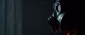 Movie still from “The Girl in the Spider's Web” (2018), directed by Fede Alvarez – A gas mask is shown with a black background; Extreme Close Up shot, Overhead angle