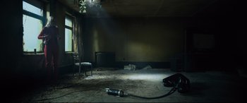 Movie still from “The Girl in the Spider's Web” (2018), directed by Fede Alvarez – A room that has a light shining on the floor; Extreme Wide shot, Low angle