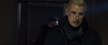 Movie still from “The Girl in the Spider's Web” (2018), directed by Fede Alvarez – A person wearing a black jacket; Close Up shot, Over the shoulder angle