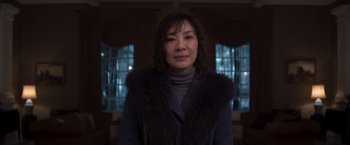 Movie still from “Crazy Rich Asians” (2018), directed by Jon M. Chu – A woman wearing a fur vest and a blue jacket; Close Up shot, Low angle