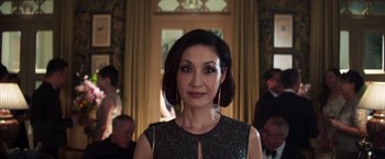Movie still from “Crazy Rich Asians” (2018), directed by Jon M. Chu – A person wearing a dress; Close Up shot, Over the shoulder angle