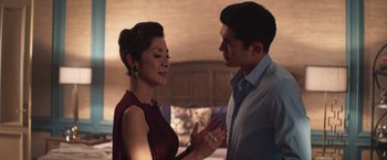 Movie still from “Crazy Rich Asians” (2018), directed by Jon M. Chu – A man and a woman talking to each other; Medium shot, Over the shoulder angle