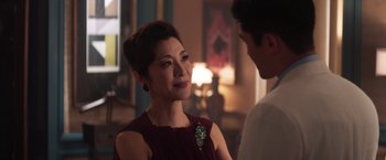 Movie still from “Crazy Rich Asians” (2018), directed by Jon M. Chu – A woman in a red dress talking to a man in a white shirt; Close Up shot, Over the shoulder angle