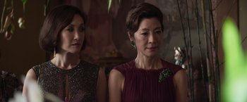 Movie still from “Crazy Rich Asians” (2018), directed by Jon M. Chu – A group of women standing next to each other; Close Up shot, Over the shoulder angle