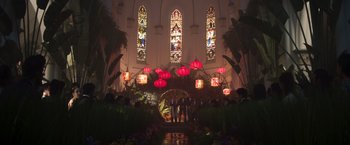 Movie still from “Crazy Rich Asians” (2018), directed by Jon M. Chu – A group of people standing in front of stained glass windows in a church; Extreme Wide shot, Low angle