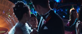 Movie still from “Crazy Rich Asians” (2018), directed by Jon M. Chu – A man and a woman in formal wear talking to each other; Close Up shot, Over the shoulder angle