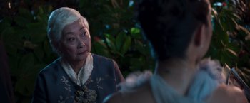 Movie still from “Crazy Rich Asians” (2018), directed by Jon M. Chu – An older woman is looking at a younger woman; Close Up shot, Over the shoulder angle