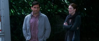 Movie still from “Crazy, Stupid, Love.” (2011), directed by Glenn Ficarra – A man and a woman standing next to each other outside; Medium shot, Over the shoulder angle