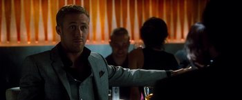 Movie still from “Crazy, Stupid, Love.” (2011), directed by Glenn Ficarra – A man standing in front of a group of people; Close Up shot, Over the shoulder angle