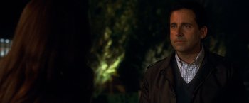 Movie still from “Crazy, Stupid, Love.” (2011), directed by Glenn Ficarra – A man in a brown jacket is standing in front of a tree; Close Up shot, Over the shoulder angle
