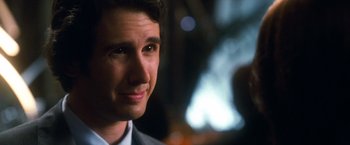 Movie still from “Crazy, Stupid, Love.” (2011), directed by Glenn Ficarra – A person wearing a suit and tie; Close Up shot, Over the shoulder angle