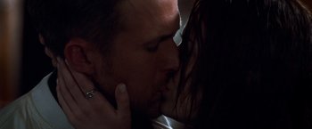 Movie still from “Crazy, Stupid, Love.” (2011), directed by Glenn Ficarra – A man and a woman kissing each other in the dark; Close Up shot, Low angle