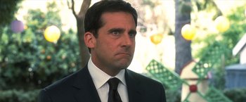 Movie still from “Crazy, Stupid, Love.” (2011), directed by Glenn Ficarra – A person wearing a suit and tie; Close Up shot, Over the shoulder angle
