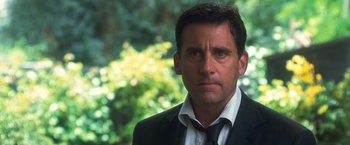 Movie still from “Crazy, Stupid, Love.” (2011), directed by Glenn Ficarra – A person wearing a suit and tie; Close Up shot, Over the shoulder angle