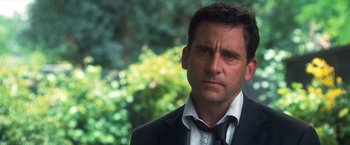 Movie still from “Crazy, Stupid, Love.” (2011), directed by Glenn Ficarra – A person wearing a suit and tie; Close Up shot, Over the shoulder angle